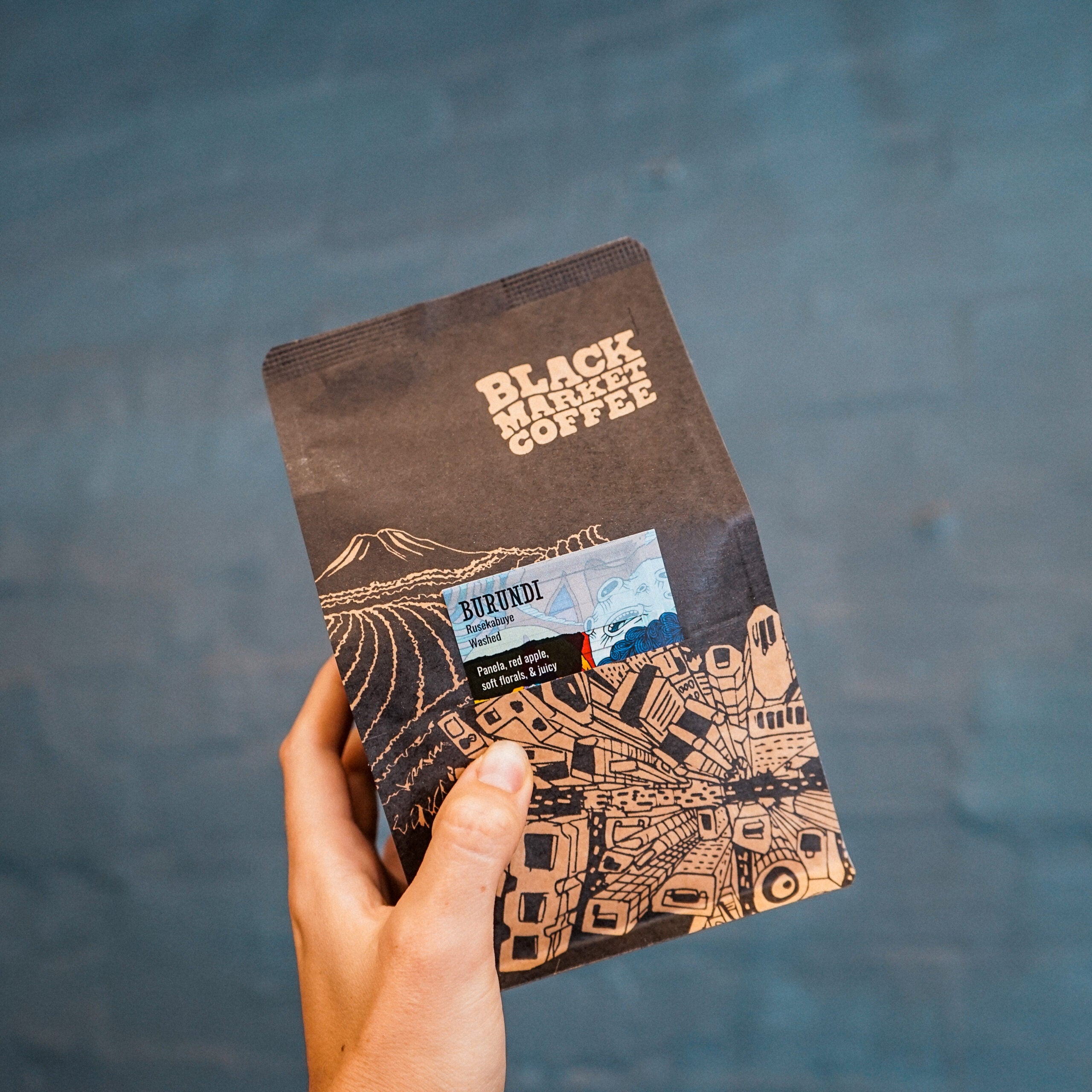 Burundi coffee bag held in hand