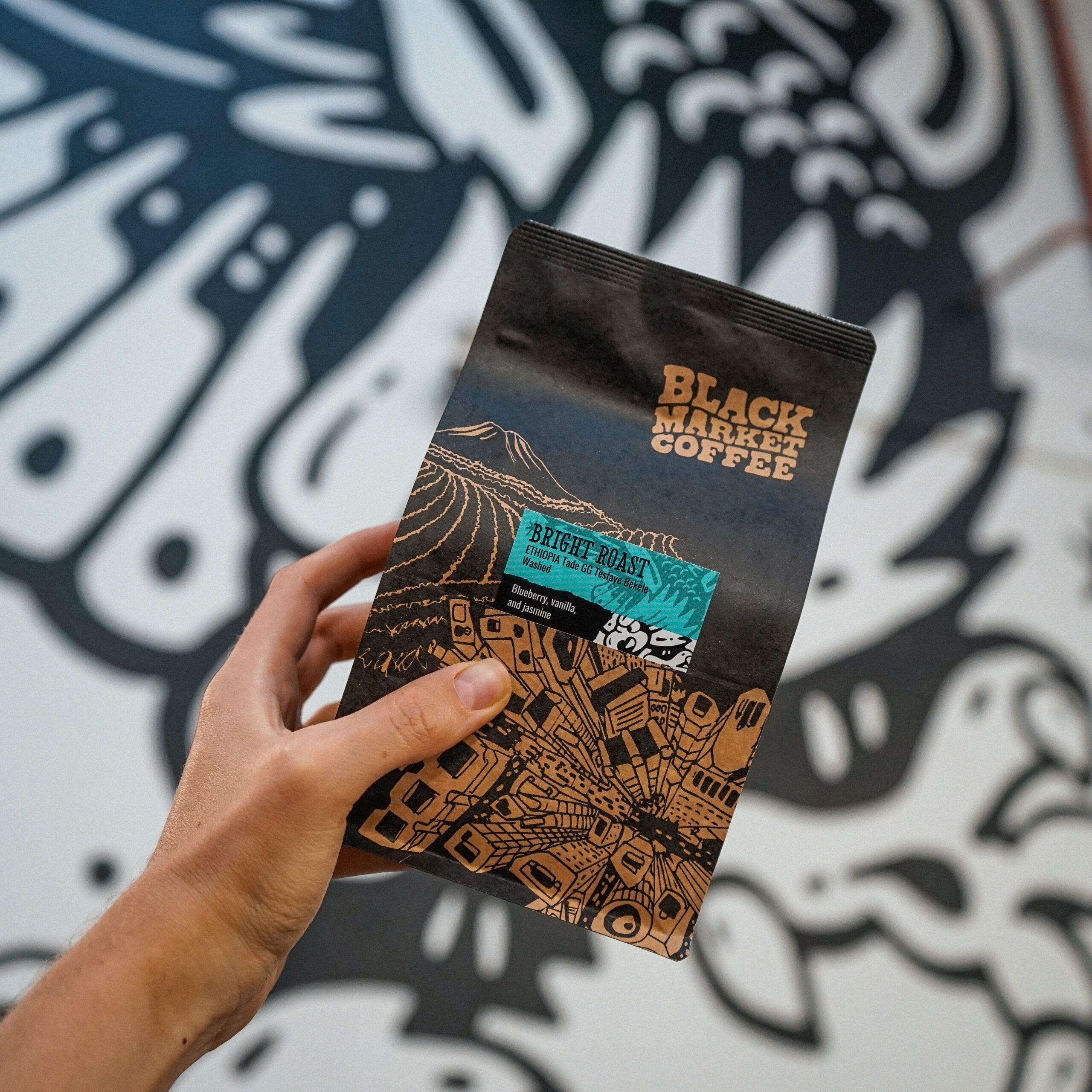 Bright Roast Ethiopia coffee beans bag held in hand in our Roastery