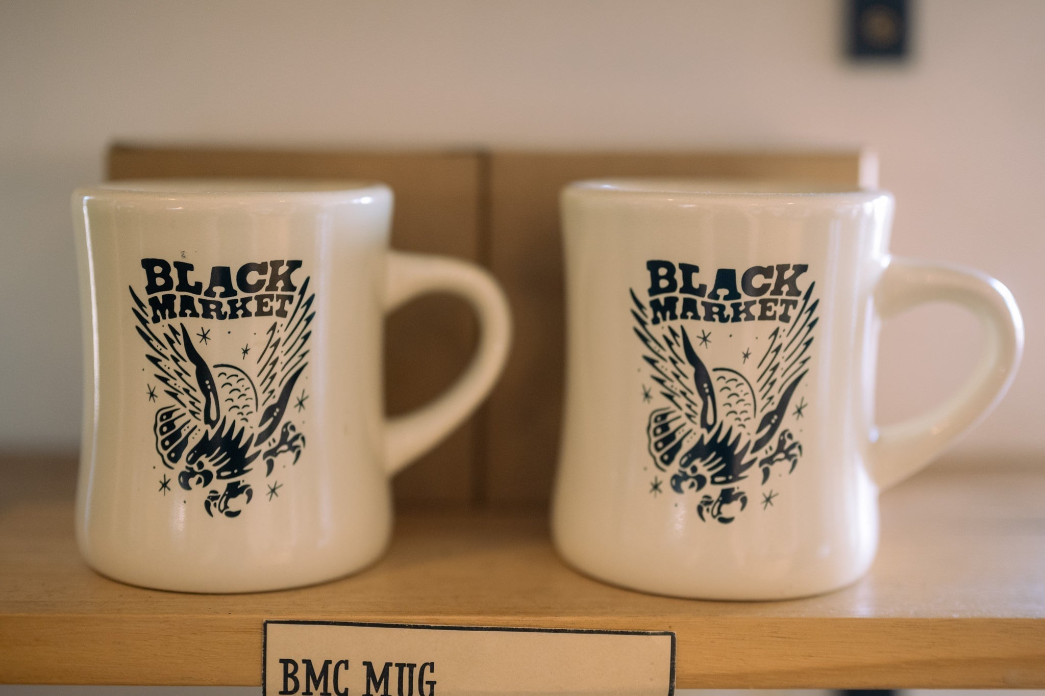 Fresh coffee beans being poured from a Black Market Coffee bag — subscription vs buying individual bags