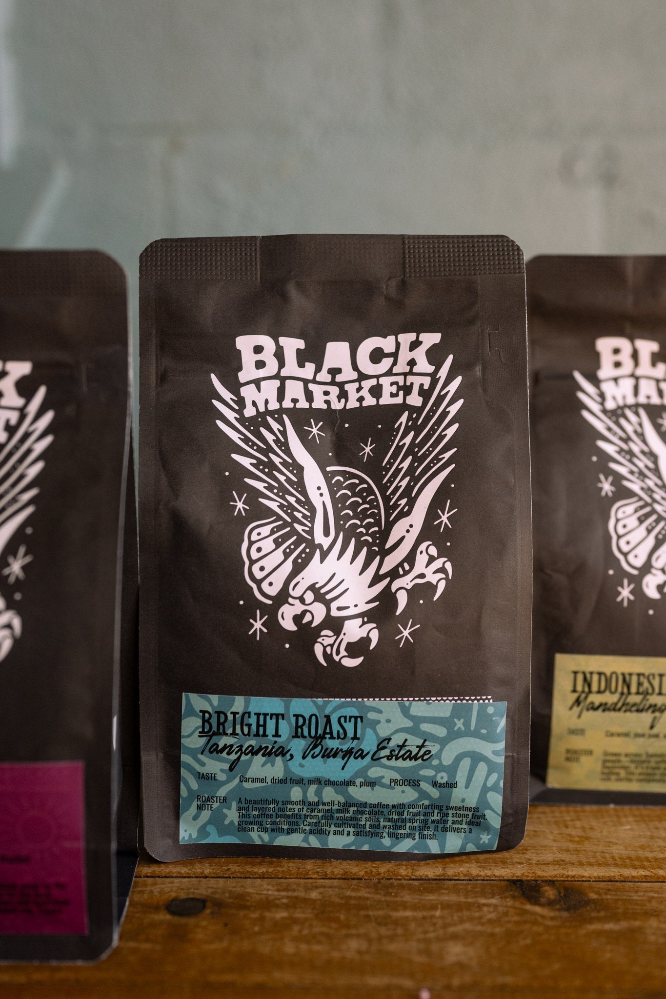 Black Market Coffee filter and espresso roast coffee beans side by side