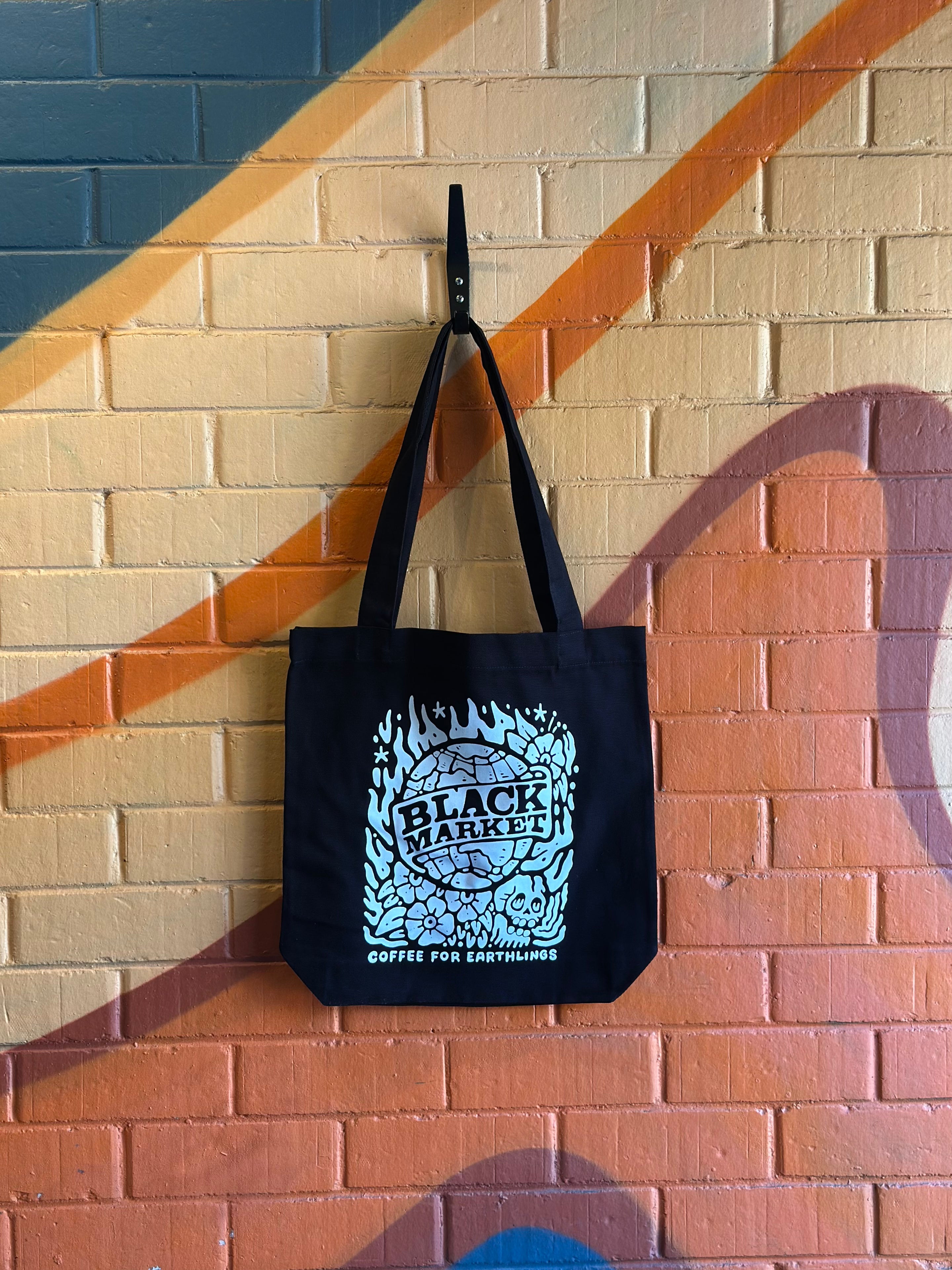 Lifestyle image showing BlackMarket Coffee tote bag in real-world setting