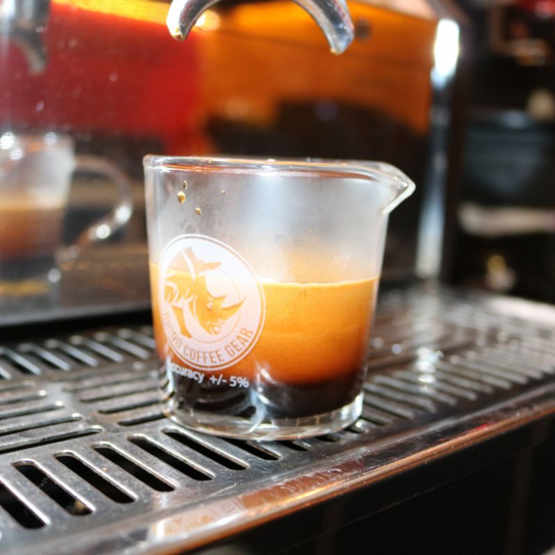 Rhino shot glass detail showing dual spouts and measurement markings for espresso